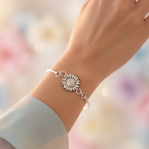 Woman wearing Sunflower Split Coil Bracelet in romantic soft lighting