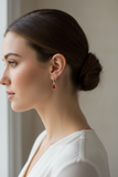 Woman wearing petite carnelian lever back earrings with clean bezel